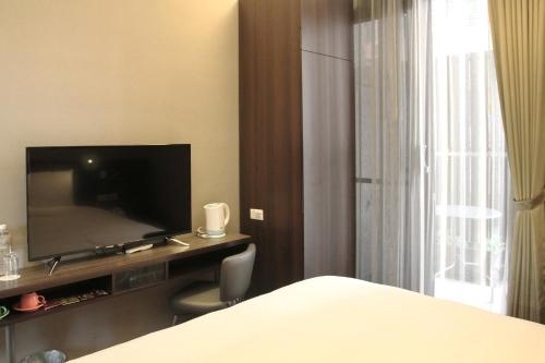 Imagen de la habitación del Hotel Capital Songshan. Foto 7