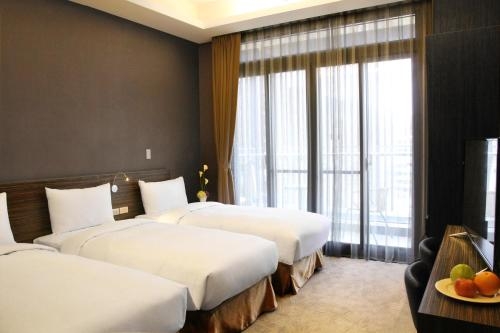 Imagen de la habitación del Hotel Capital Songshan. Foto 9
