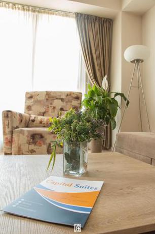 Imagen de la habitación del Hotel Capitоl Suites. Foto 19