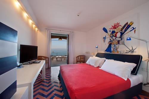 Imagen de la habitación del Hotel Capo La Gala and Wellness. Foto 5