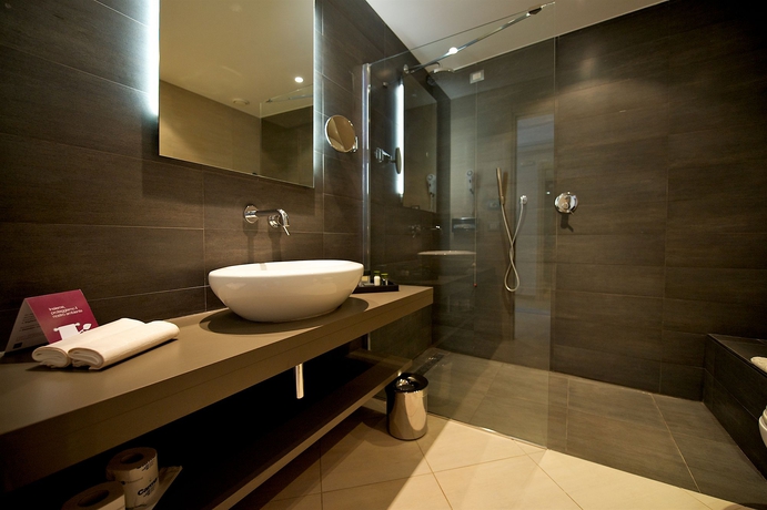 Imagen de la habitación del Hotel Capovaticano Resort Thalasso Spa. Foto 4