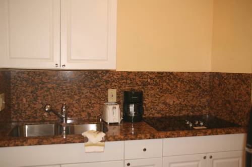 Imagen de la habitación del Hotel Capri Apartments. Foto 13