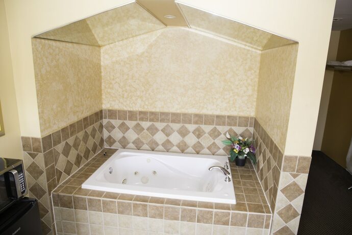 Imagen de la habitación del Hotel Capri inn and Suites. Foto 12