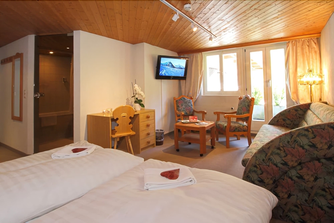 Imagen de la habitación del Hotel Caprice, Grindelwald. Foto 14