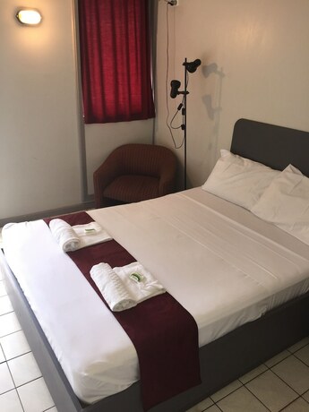 Imagen de la habitación del Hotel Capricornia Motel. Foto 19