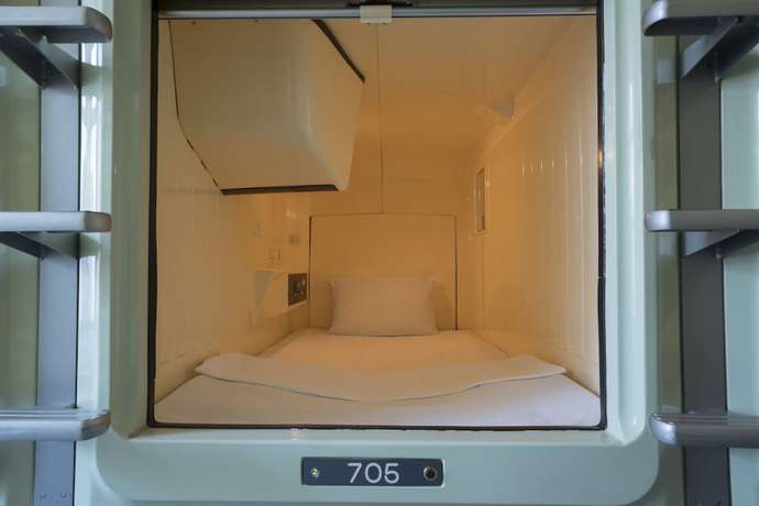 Imagen de la habitación del Hotel Capsule Inn Hamamatsucho. Foto 16