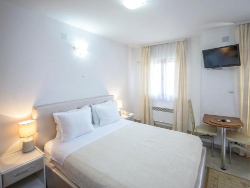 Imagen de la habitación del Hotel Captain Apartments. Foto 8
