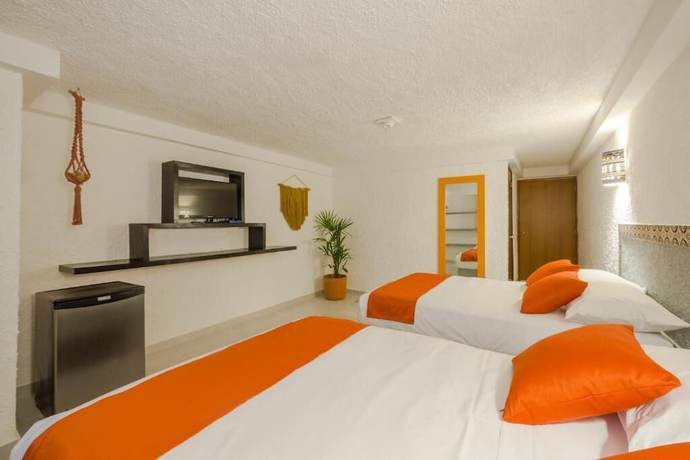 Imagen de la habitación del Hotel Caracol Puerto Morelos. Foto 5