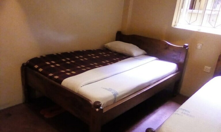 Imagen de la habitación del Hotel Care Guest House. Foto 9