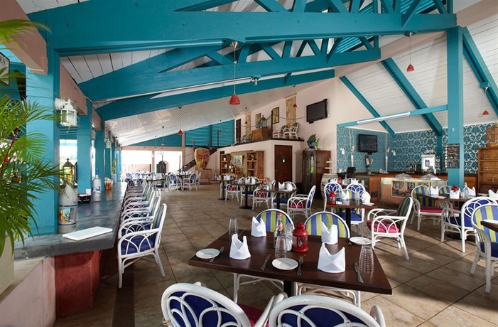 Imagen del bar/restaurante del Hotel Caribbean Palm Village Resort. Foto 1