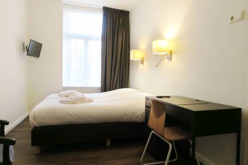 Imagen de la habitación del Hotel Carillon, Haarlem. Foto 5