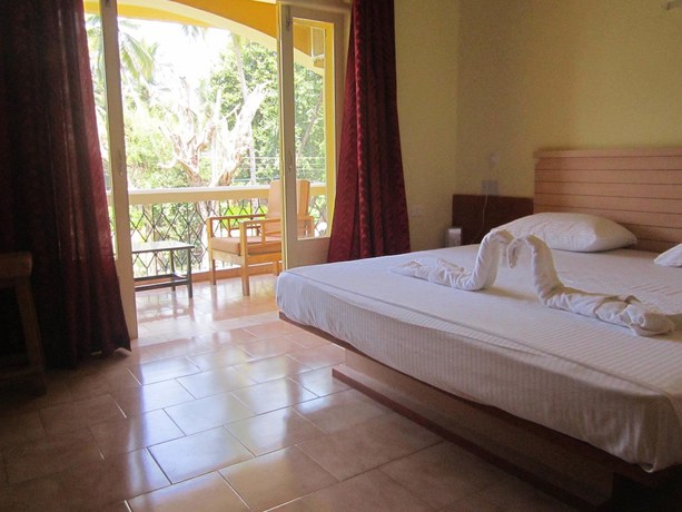 Imagen de la habitación del Hotel Carina Beach Resort. Foto 10