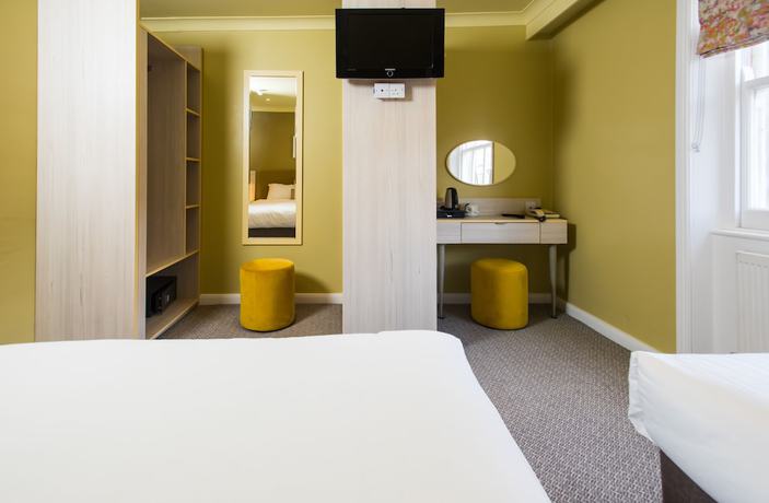 Imagen de la habitación del Hotel Caring. Foto 1