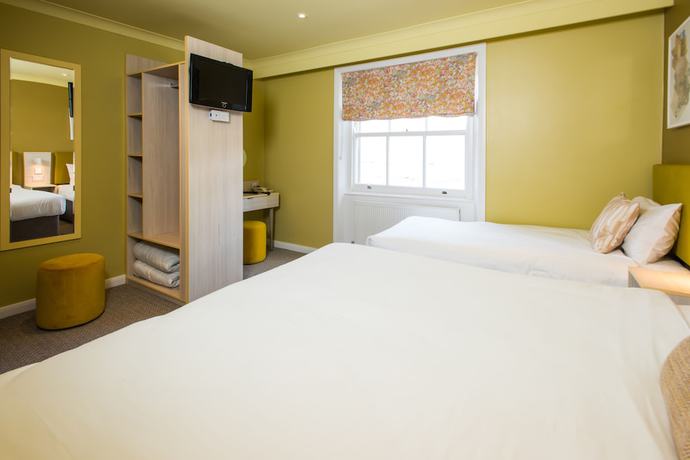 Imagen de la habitación del Hotel Caring. Foto 6