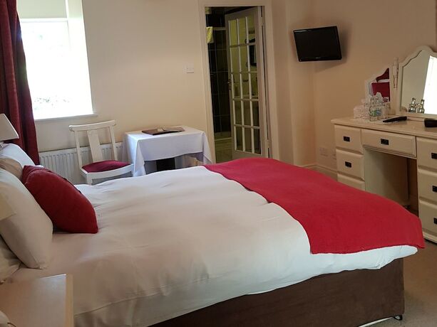 Imagen de la habitación del Hotel Carrygerry Country House. Foto 19