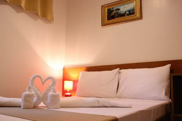 Imagen de la habitación del Hotel Casa Belina Tourist Inn. Foto 15
