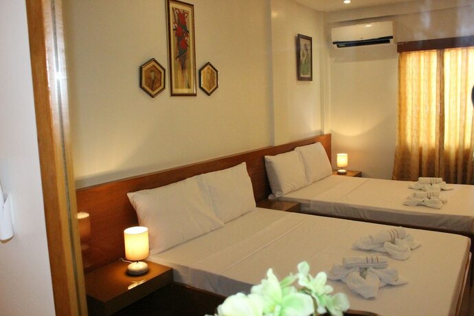 Imagen de la habitación del Hotel Casa Belina Tourist Inn. Foto 18
