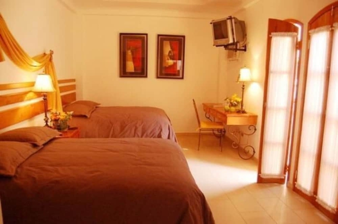 Imagen de la habitación del Hotel Casa Del Arbol. Foto 12