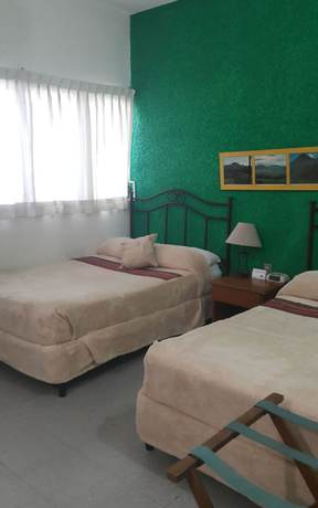 Imagen de la habitación del Hotel Casa Flores De Tikal. Foto 9