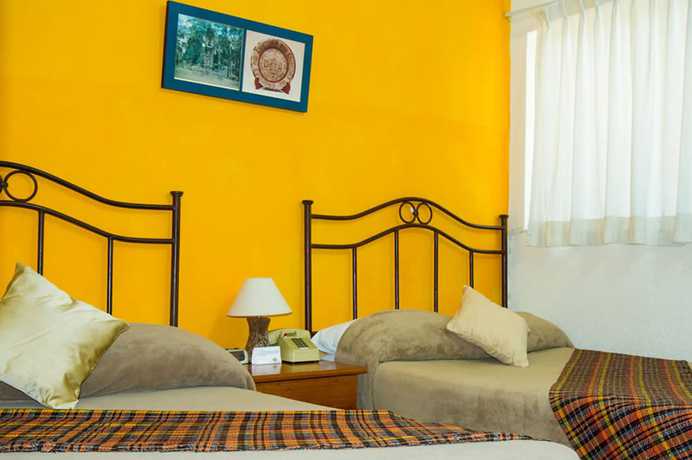 Imagen de la habitación del Hotel Casa Flores De Tikal. Foto 11