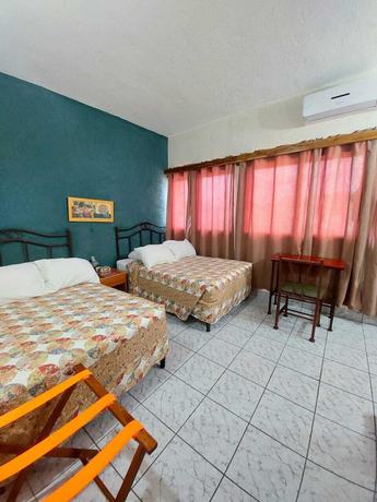 Imagen de la habitación del Hotel Casa Flores De Tikal. Foto 14