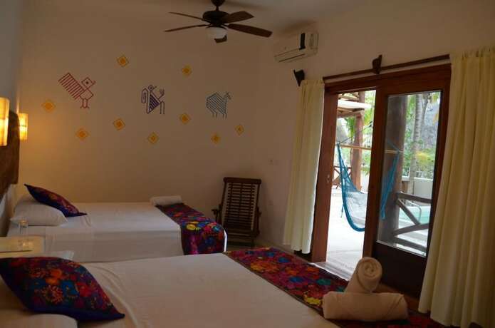 Imagen de la habitación del Hotel Casa Iguana Holbox. Foto 16