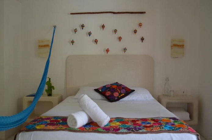 Imagen de la habitación del Hotel Casa Iguana Holbox. Foto 20