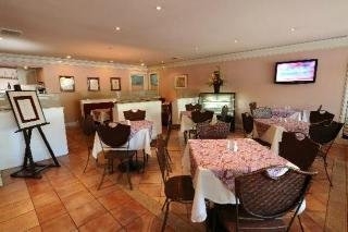 Imagen del bar/restaurante del Hotel Casa Leticia Business Inn. Foto 8