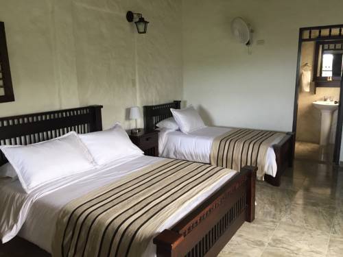 Imagen de la habitación del Hotel Casa Nogales Bosques Del Saman. Foto 1