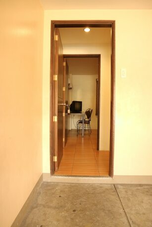 Imagen de la habitación del Hotel Casa Palmera Tourist Inn. Foto 19