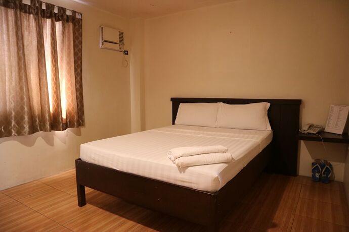 Imagen de la habitación del Hotel Casa Palmera Tourist Inn. Foto 20