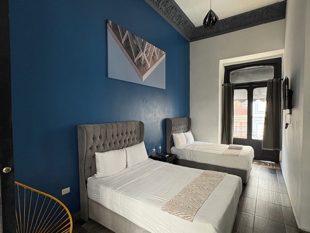 Imagen de la habitación del Hotel Casa Puebla. Foto 5