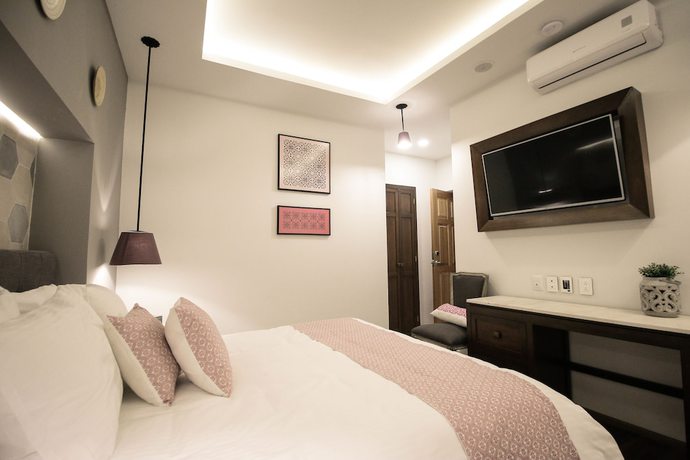Imagen de la habitación del Hotel Casa Rosa Gran Boutique. Foto 4