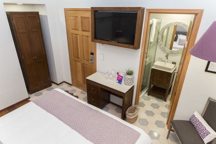 Imagen de la habitación del Hotel Casa Rosa Gran Boutique. Foto 13