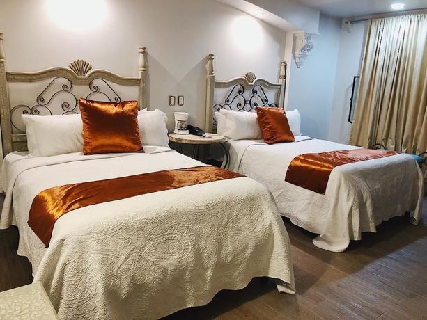 Imagen de la habitación del Hotel Casa de los Angeles. Foto 16