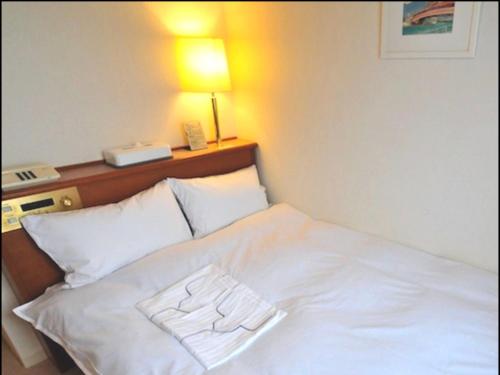 Imagen de la habitación del Hotel Casabella Inn Kobe. Foto 9