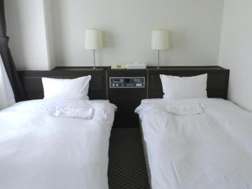 Imagen de la habitación del Hotel Casabella Inn Kobe. Foto 10