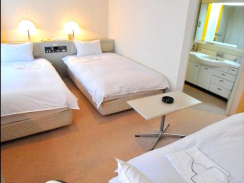 Imagen de la habitación del Hotel Casabella Inn Kobe. Foto 11