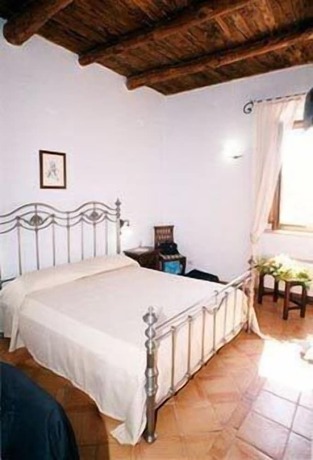 Imagen de la habitación del Hotel Casale 900. Foto 18