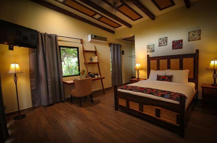 Imagen de la habitación del Hotel Cassia Hill Resort. Foto 13