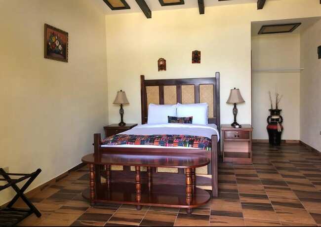 Imagen de la habitación del Hotel Cassia Hill Resort. Foto 18