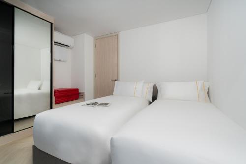 Imagen de la habitación del Hotel Cassia Rama 9 Bangkok by Banyan Group. Foto 5
