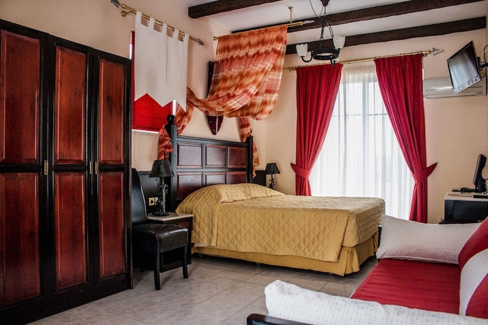 Imagen de la habitación del Hotel Castello Di Cavallieri Suites. Foto 16