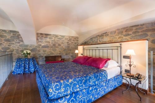 Imagen de la habitación del Hotel Castello Di Pontebosio Luxury Resort. Foto 7