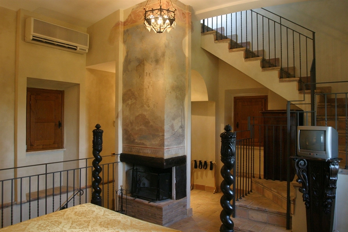 Imagen de la habitación del Hotel Castello della Castelluccia. Foto 7