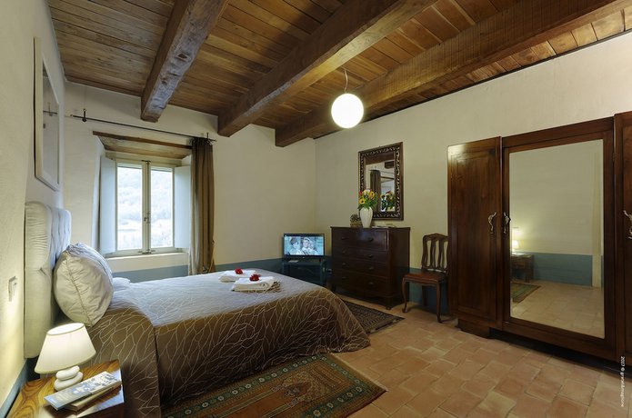 Imagen de la habitación del Hotel Castello di Postignano Relais. Foto 18