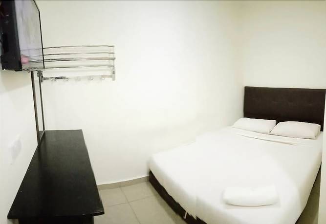 Imagen de la habitación del Hotel Cattleya Glory. Foto 2