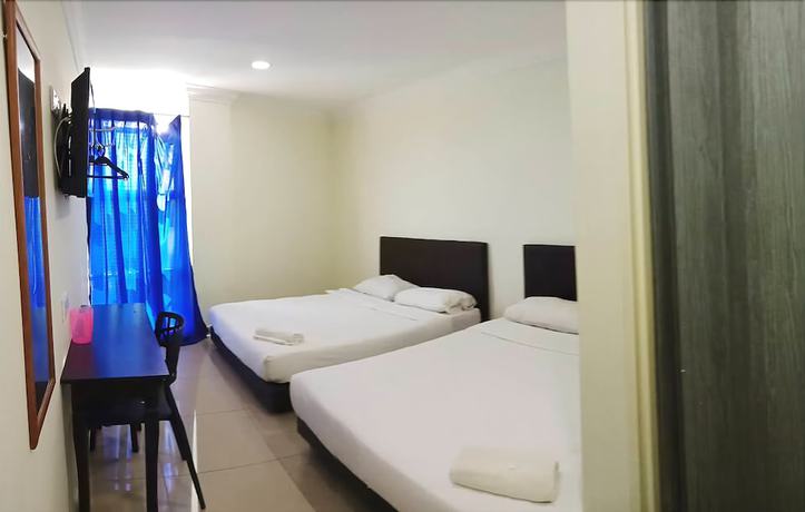 Imagen de la habitación del Hotel Cattleya Glory. Foto 9