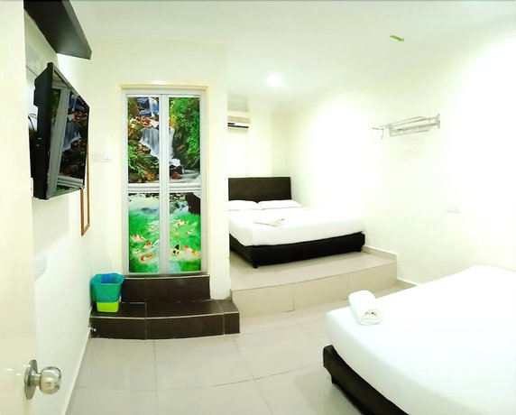 Imagen de la habitación del Hotel Cattleya Glory. Foto 12