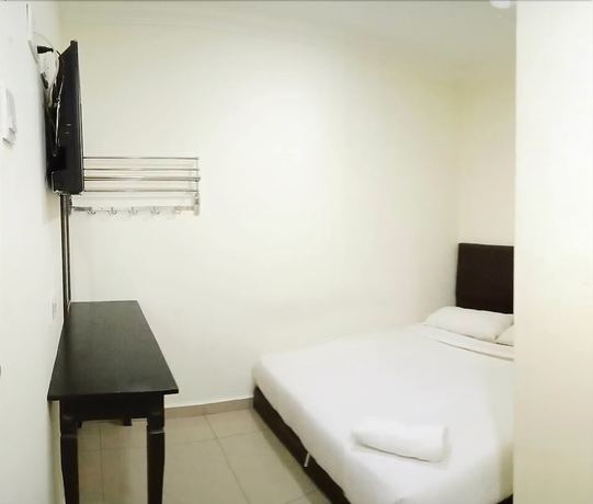 Imagen de la habitación del Hotel Cattleya Glory. Foto 16
